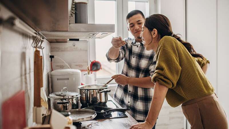 Someone cooking a meal for you is a top food turn-on, for over half of Brits (Image: South Agency/Getty Images)