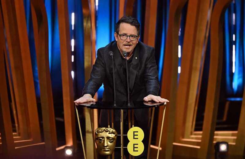 The star bravely stood from his wheelchair to deliver a moving speech at the Baftas