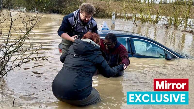 The man is helped to safety by Jamie and his partner (Image: Stephen Huntley)