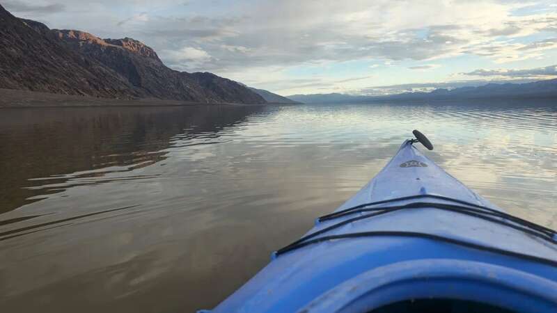 A kayak is taken out on the lake formed at the Badwater Basin in Death Valley - usually the driest and hottest place in the US (Image: Michael Kohler/NPS)