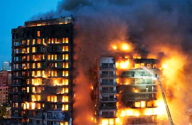 Dramatic footage shows the building engulfed in flames as firefighters battled to rescue residents from balconies