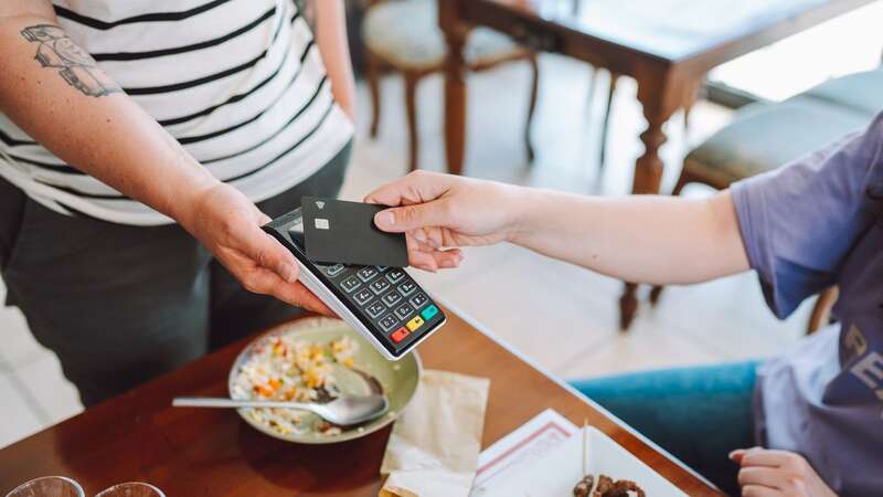 Most food servers are tipped in money (Image: Getty Images)