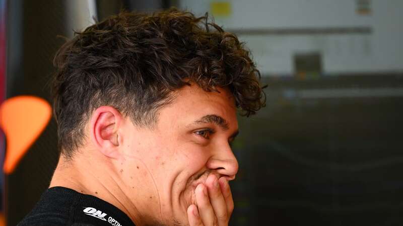 Lando Norris looks on in the pitlane during a red flag delay during (Image: Clive Mason)