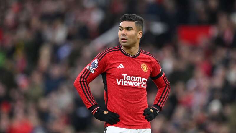 Casemiro of Manchester United swaps shirts with Rodrigo Muniz of Fulham at half-time