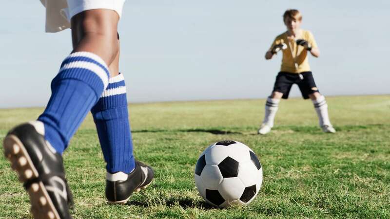 A black boy playing football was attacked, says his mum (Image: Getty Images)