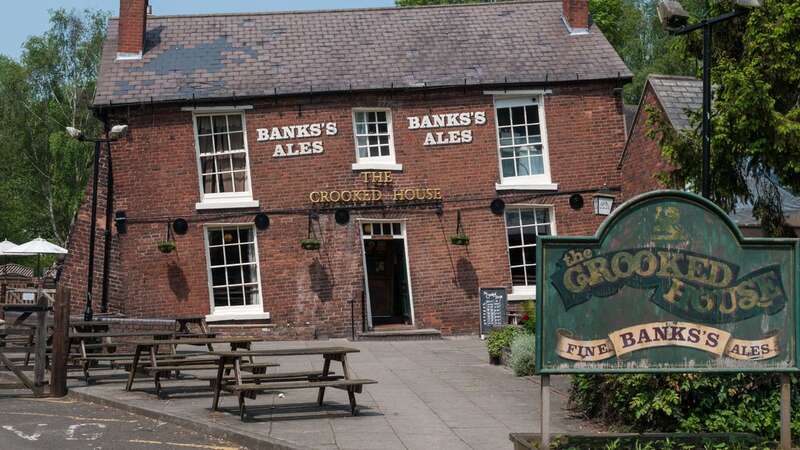 The Crooked House has been ordered to be rebuilt (Image: PA)