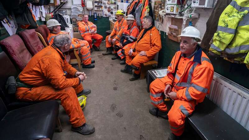 Former miners, who now work as tour guides, relax at the National Coal Mining Museum for England (Image: PA)