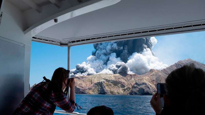 A satellite photo made available by MAXAR Technologies shows the White Island (Whakaari) volcano one day after erupting