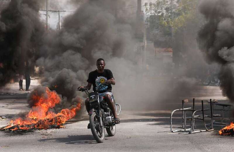 Port-au-Prince has become an active warzone as police battle with armed gangs who have taken the city hostage