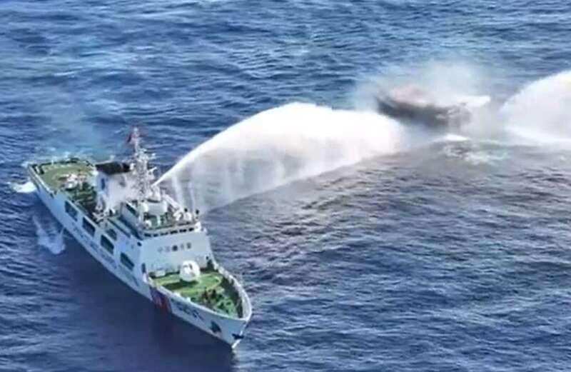 Chilling footage shows the civilian boat being pummeled from both sides by the water cannon