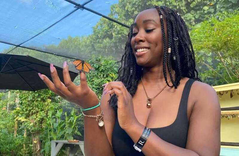 Scarlette Douglas let her natural beauty shine as she posed in a butterfly house.