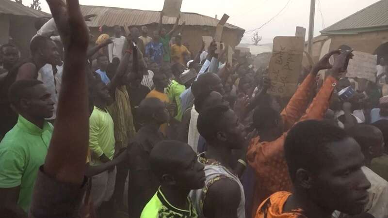 Families of abducted pupils gathering during the visit of the Kaduna State governor Uba Sani after gunmen kidnapped over 280 from a school in Kuriga (Image: AFPTV/AFP via Getty Images)