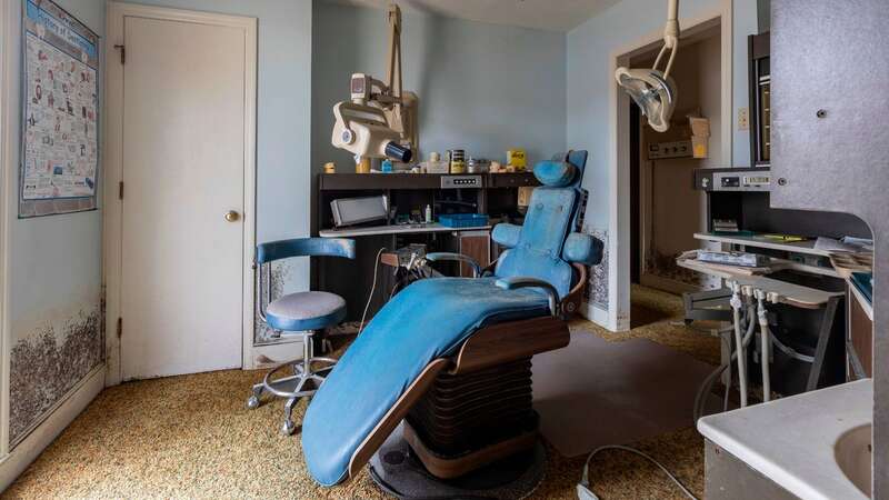 Mould-covered walls and yanked out teeth occupy this eerie empty dental surgery (Image: mediadrumimages/Leland Kent)