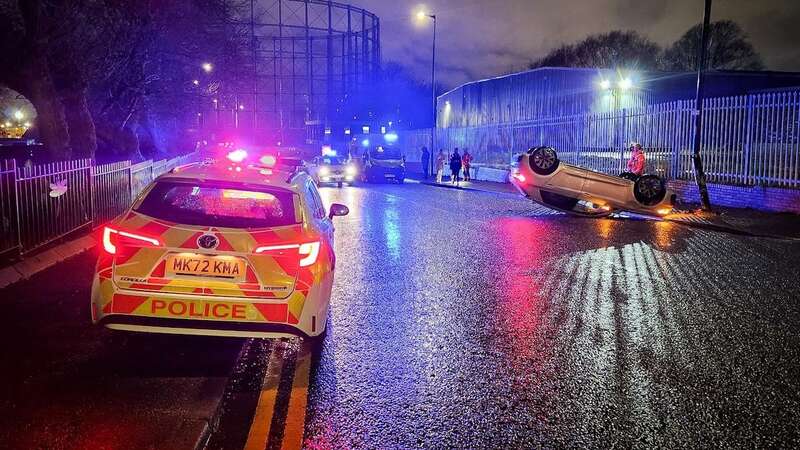 The Audi appeared to flip onto its roof after smashing into a lamp post (Image: ASP)