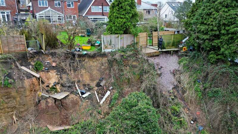 John Hingley says a landslip at the rear of his house is moving rapidly (Image: Express & Star/SWNS)