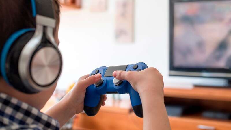 A child therapist is sharing how to handle if your child becomes aggressive on video games (stock image) (Image: Getty Images)