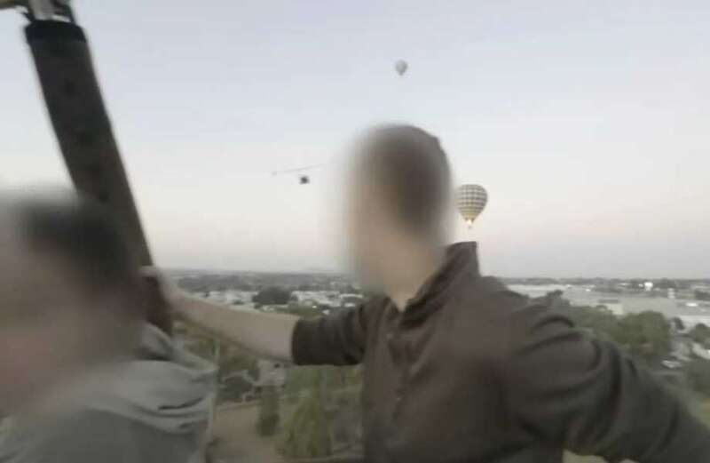 Footage shows the man taking in the views with other passengers as the balloon takes off for sunrise