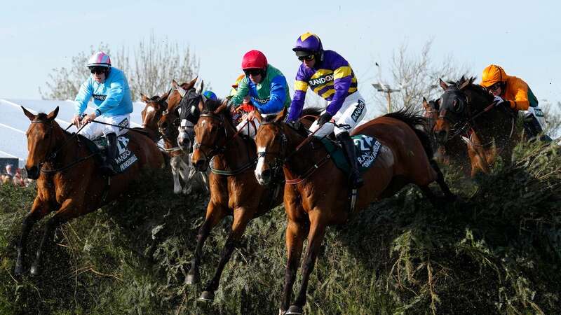 The Lucinda Russell-trained Corach Rambler, right, clears the Chair fence before going on to win the 2023 Randox Grand National (Image: AP Photo/Jon Super)