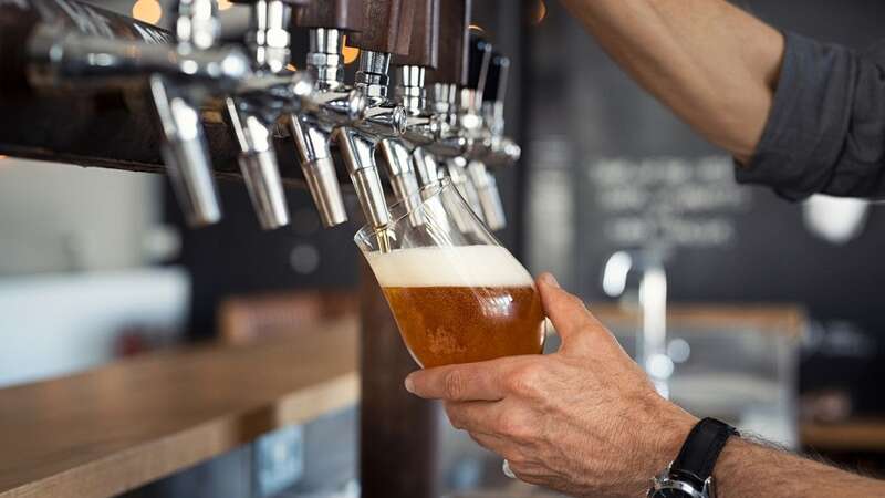 Scientists have recommended that pubs put non-alcoholic beers on tap after a study found they were popular (stock image) (Image: Getty Images/iStockphoto)