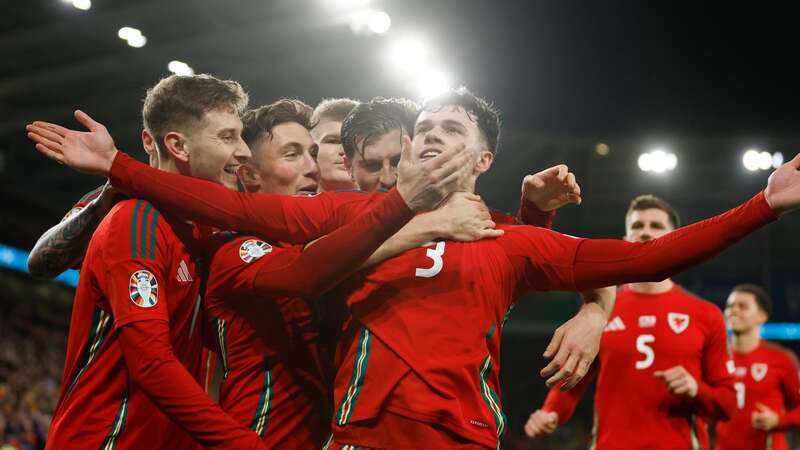 Neco Williams celebrates scoring Wales