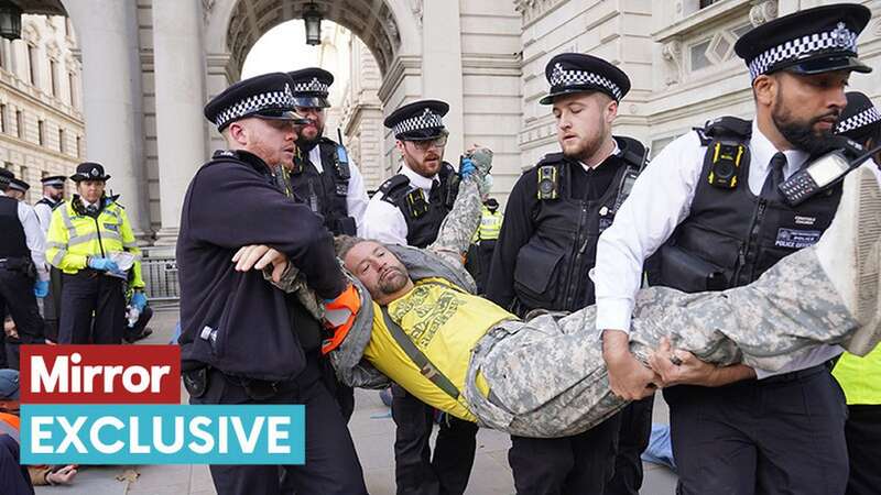 Officers from the Metropolitan Police remove a Just Stop Oil protester (Image: PA)