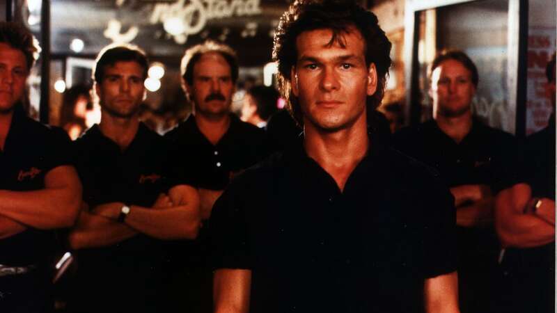 Patrick Swayze starred as James Dalton in the film (Image: Channel 5)