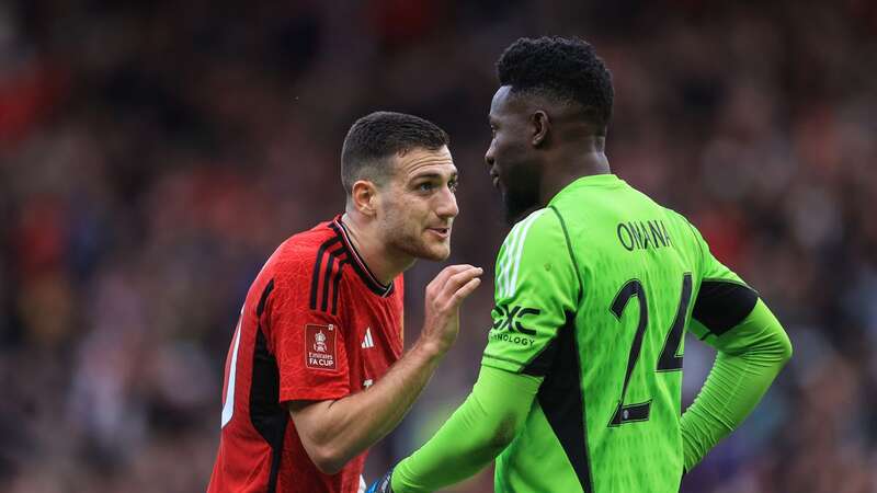 Diogo Dalot speaking with Andre Onana during Man United