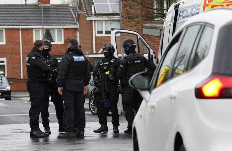 Photos showed armed police holding automatic weapons and wearing body armour