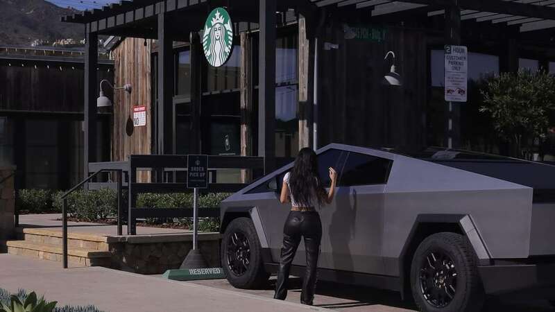 Kim Kardashian has been slammed over posing outside Starbucks