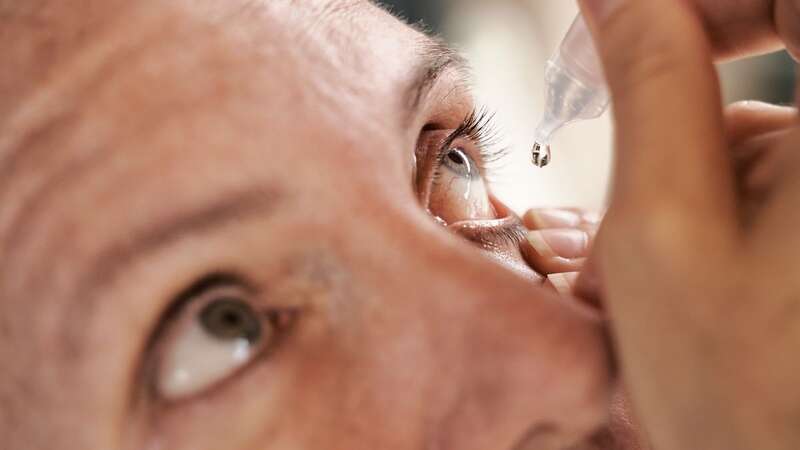 A woman is seen applying eye drops (file image) (Image: Getty Images)