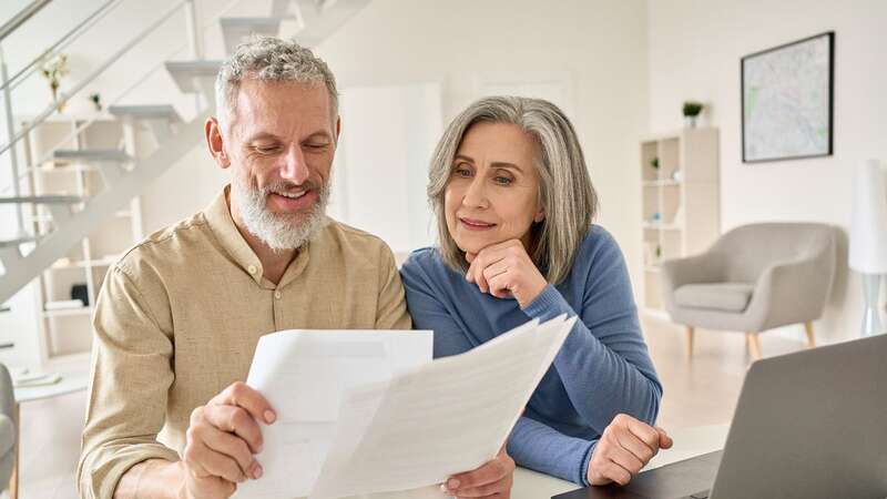 A couple assess their finances at home (Image: Getty Images/iStockphoto)