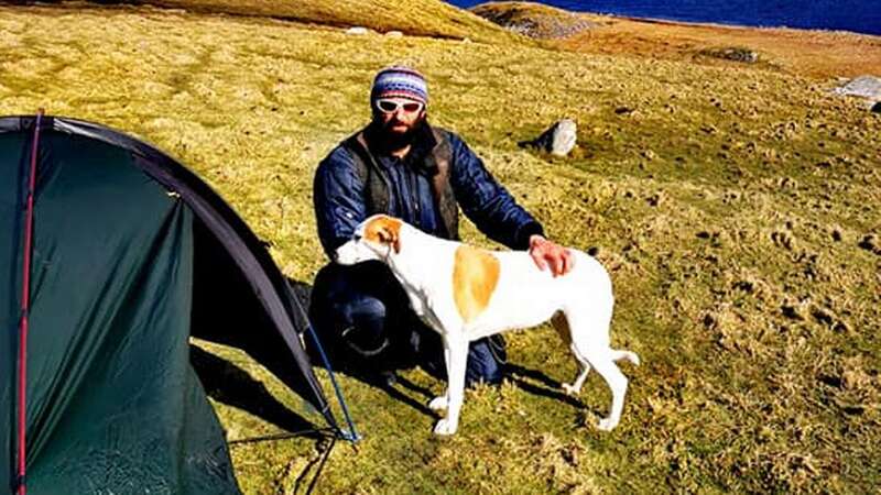 Chris Lewis with dog Jet in the Shetlands (Image: Chris Lewis/PA)