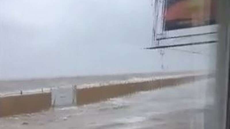 Incredible moment lifeboat crew saves people from café after tide floods road