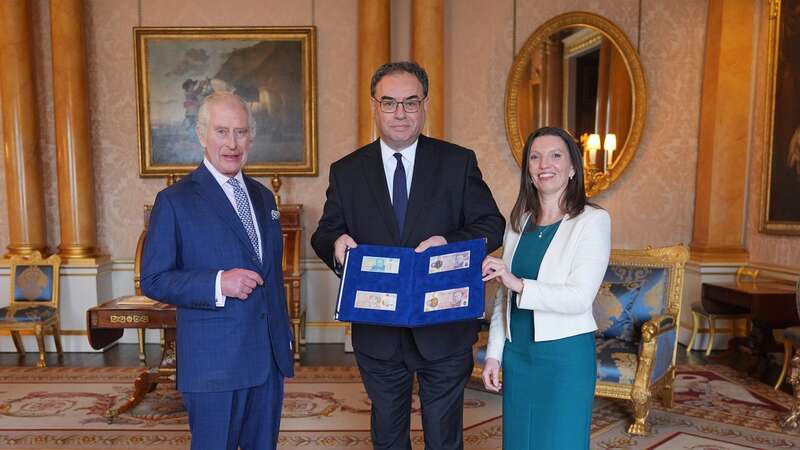 The King poses with the new notes presented by Bank of England Governor Andrew Bailey and Chief Cashier Sarah John (Image: PA Wire/PA Images)