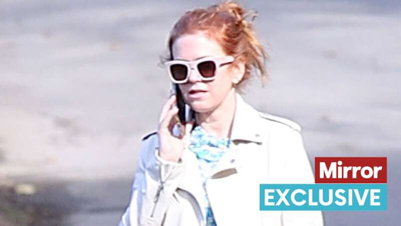 Downcast Isla Fisher ditches her wedding ring as she breaks cover after Sacha Baron Cohen split news (Image: SplashNews.com)