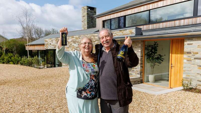 Rose Doyle with husband Tony outside their new home (Image: Omaze / SWNS)