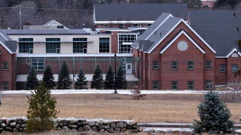 The Sununu Youth Services Center in Manchester, N.H., stands among trees, (Image: AP)