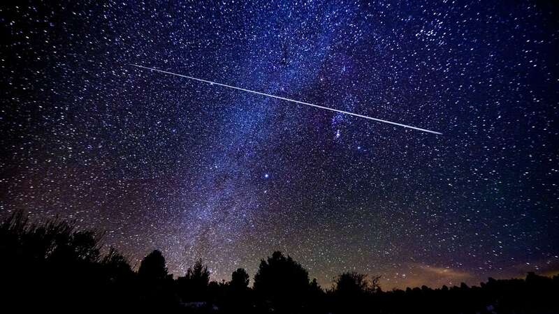 The stunning meteor shower occurs as Earth moves through a patch of dust and rock left behind be a comet (Image: Getty Images)