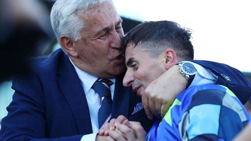 Andrea Atzeni gets a kiss from Sebastian Cherchi, whose son Stefano died in a race fall (Image: Getty Images)