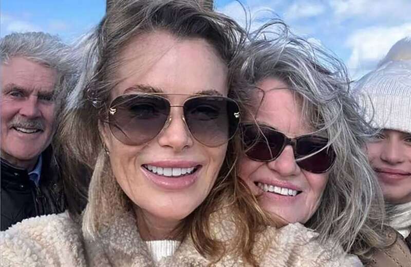 The blonde bombshell, 53, went for a windy walk with her family - despite the ongoing war of words