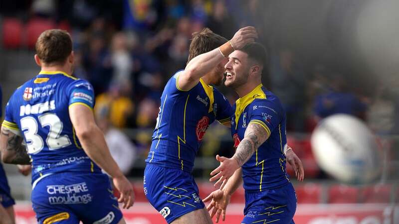 Connor Wrench, right, celebrates his try for Warrington against St Helens (Image: PA)