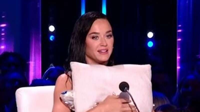 Katy Perry suffers wardrobe malfunction during live show and cowers behind desk