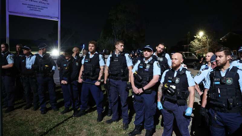 Police guard the perimeter of the Christ the Good Shepherd Church in Sydney (Image: AFP via Getty Images)