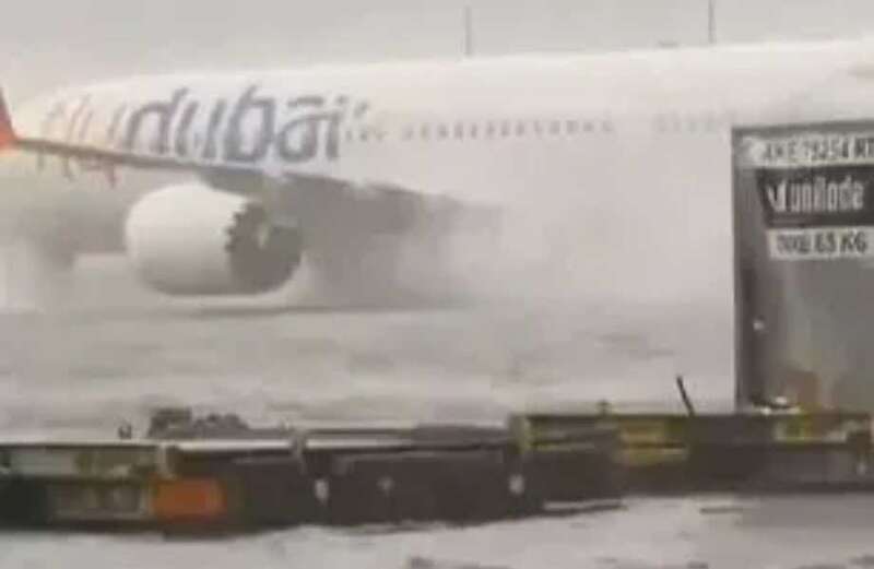 Planes, cars and people were forced to wade through intense flood water as seen in the clips above