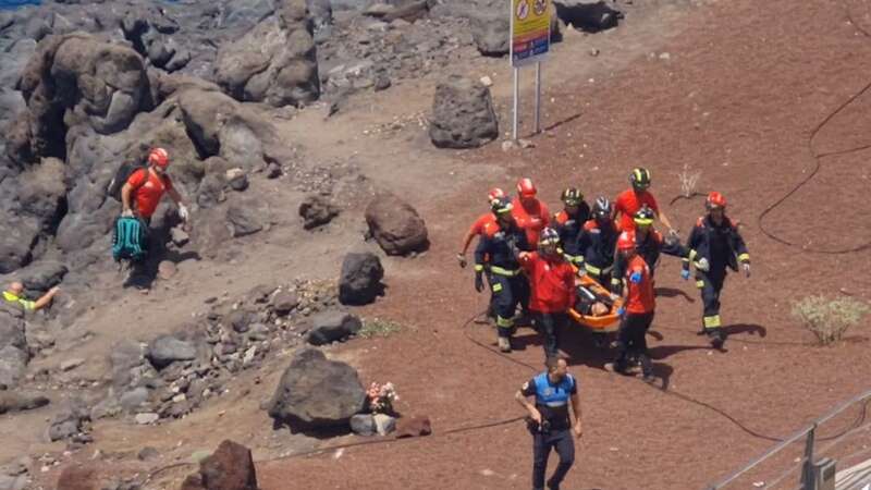 Rescue workers at the scene of the accident (Image: No credit)