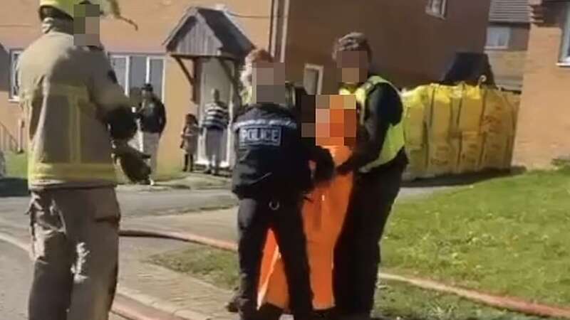 Dramatic moment woman is arrested after 