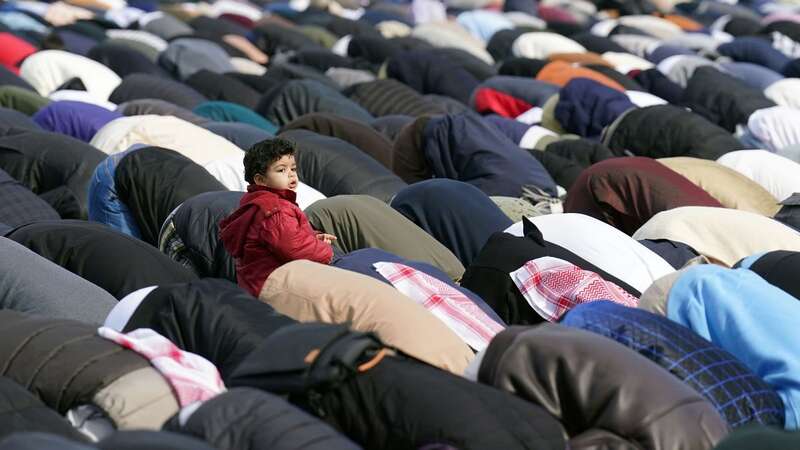 Worshippers during morning prayers as the holy month of Ramadan came to an end (Image: PA)