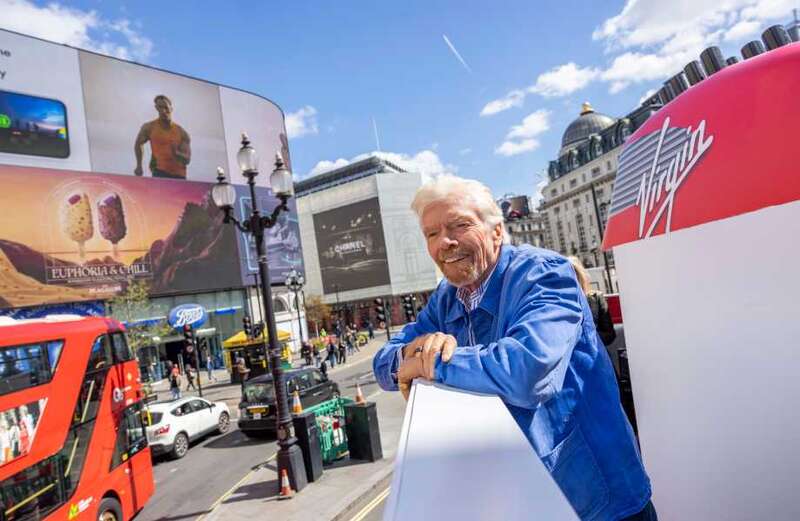 Lucky passers-by screamed and cheered as they were given free holidays