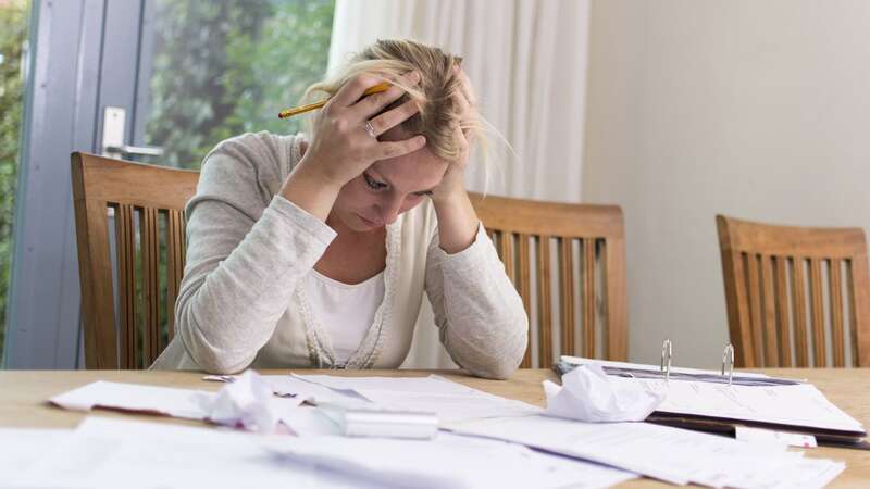 Woman worried about financial problems (Image: Getty Images/iStockphoto)