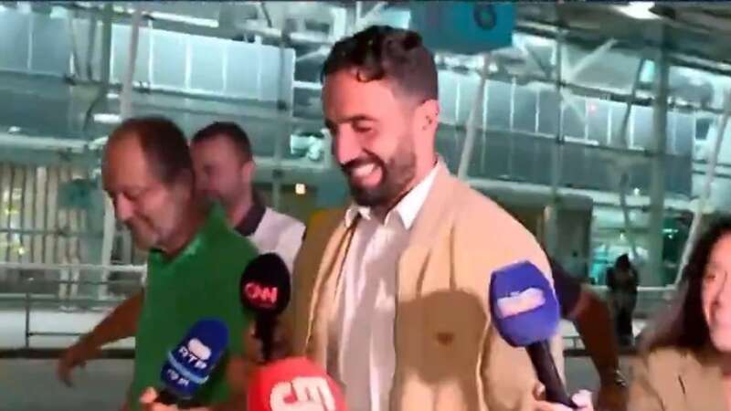 Ruben Amorim is questioned by reporters at Lisbon airport (Image: CMTV)